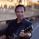 Steve Wyle playing guitar