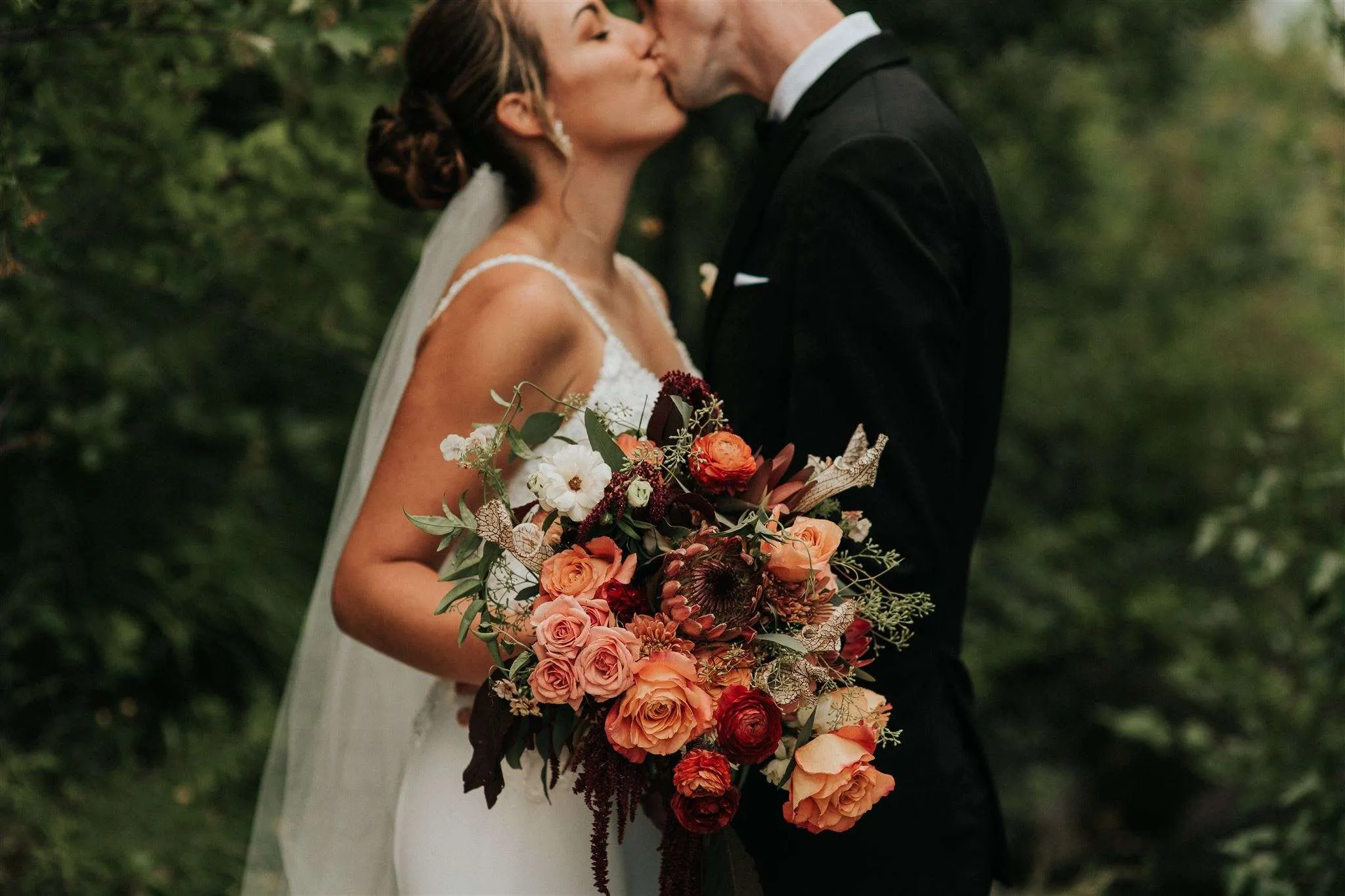 A bride and groom kissing