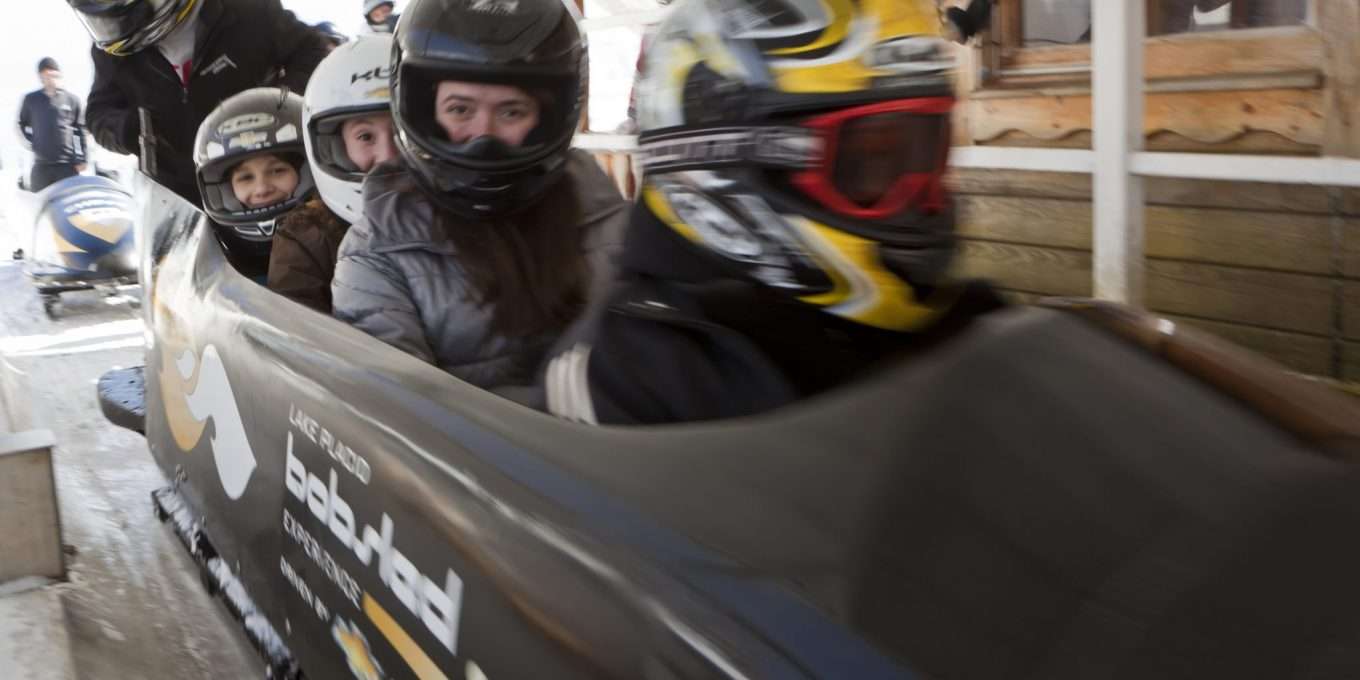 Four children in a bobsled.
