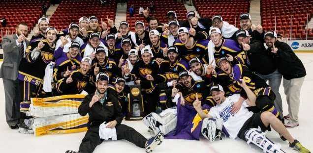 Photo of hockey team in black jerseys on the ice