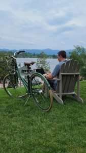 Man in chair overlooking lake