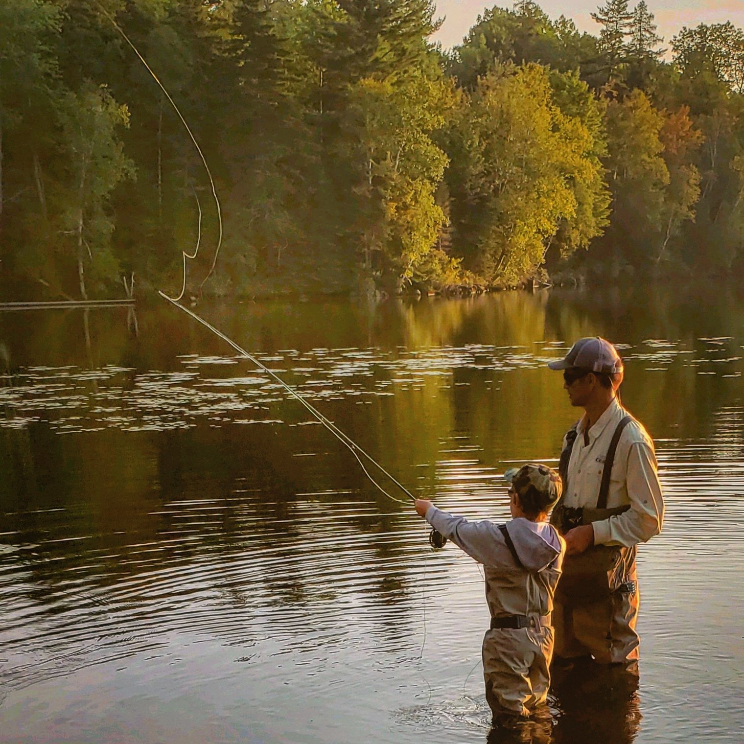 Father and son fly fishing