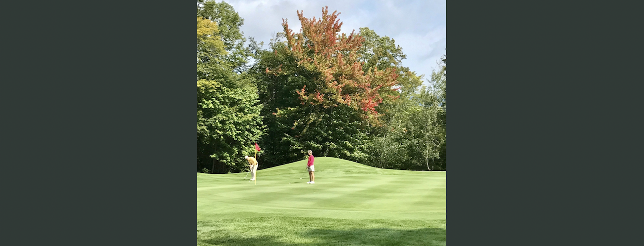 couple playing golf