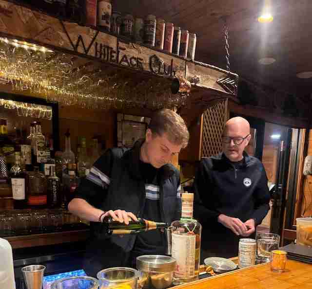 Making drinks at a bar