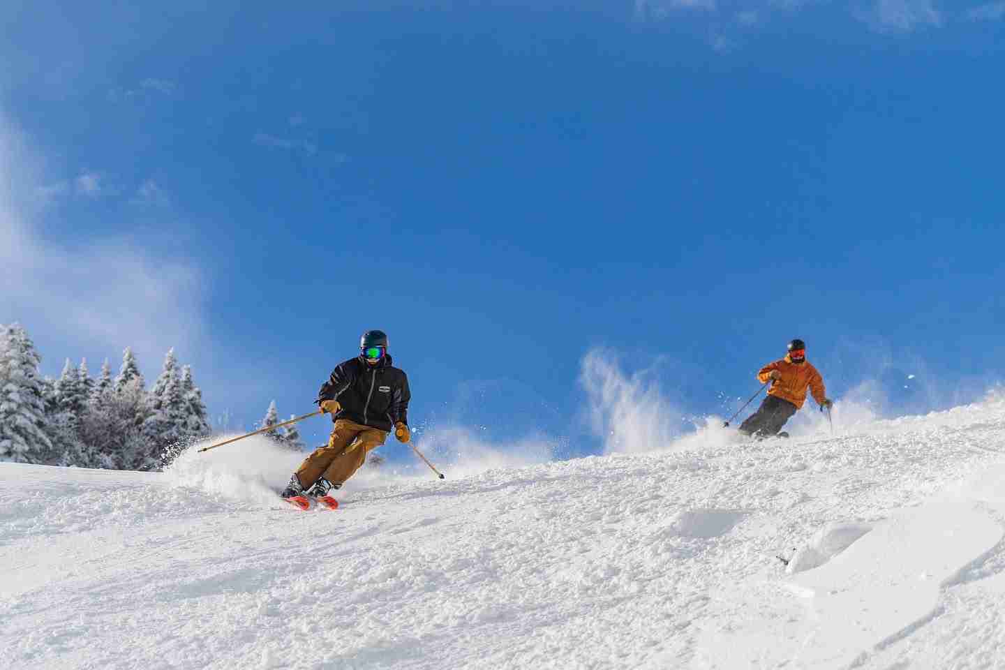 two skiers on slope